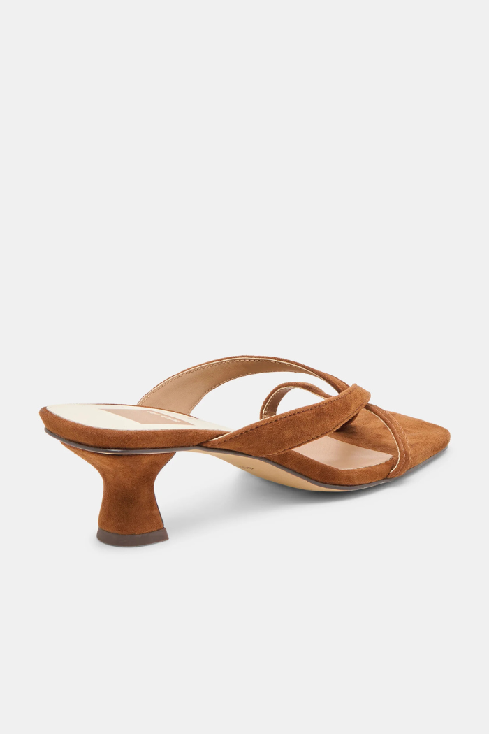 Brown suede sandal with a low heel on a white background