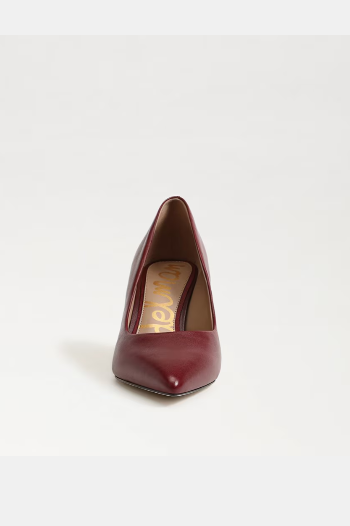 Maroon high-heeled shoe on a white background