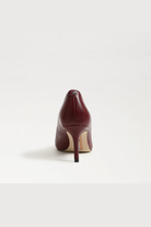 Burgundy high-heeled shoe on a white background