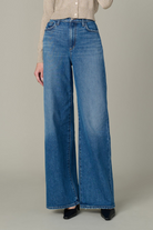 Wide-leg jeans worn by a person on a neutral background