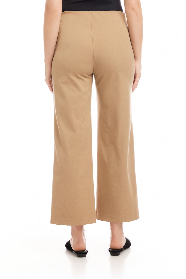 Beige wide-leg pants worn by a person on a white background