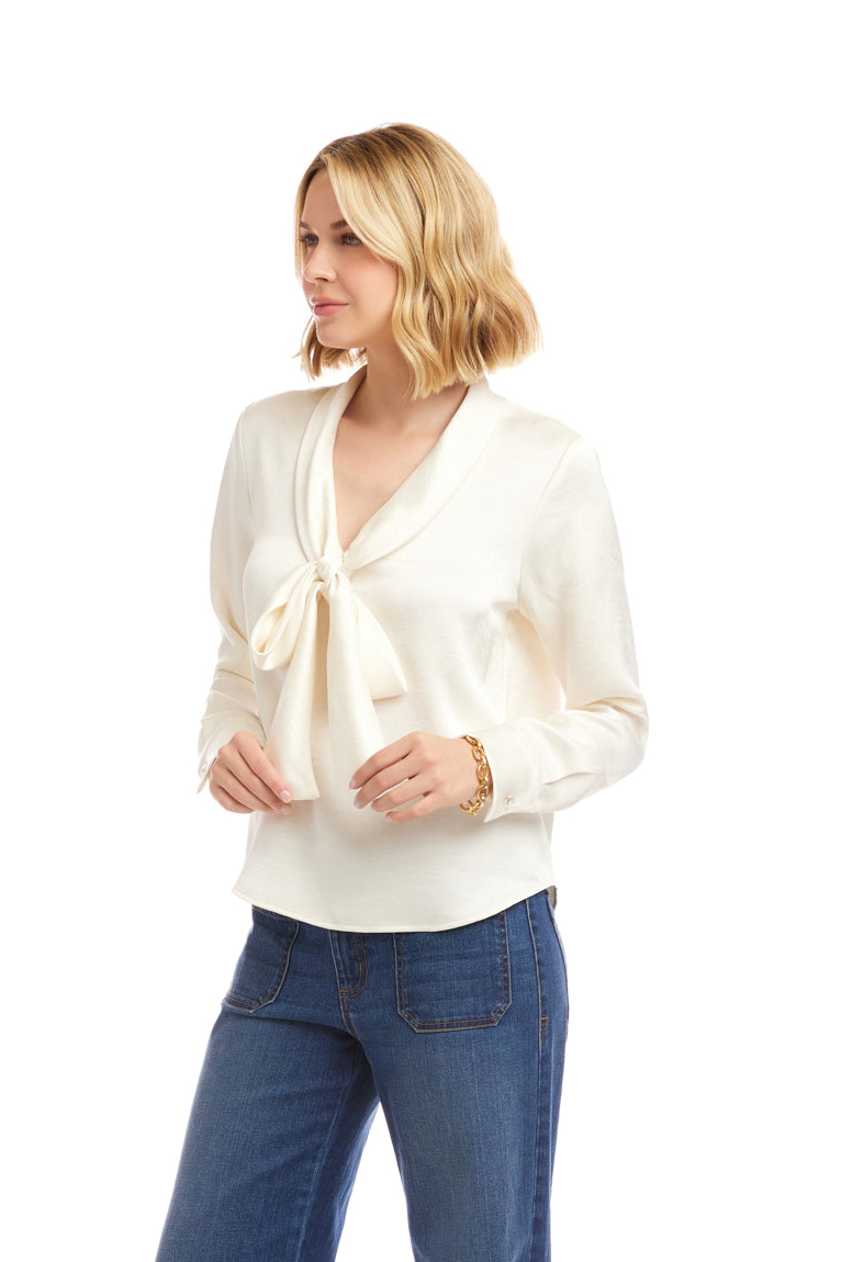 Woman wearing a white blouse and blue jeans on a white background