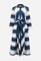 Long blue and white striped dress with a belt on a white background