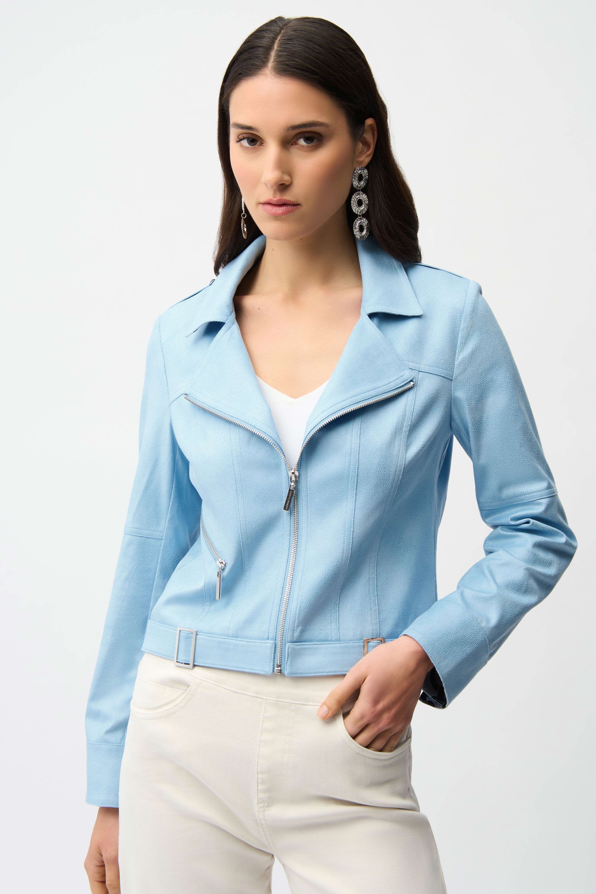 Woman wearing a light blue jacket on a white background