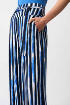 Striped pants with a blue top on a white background
