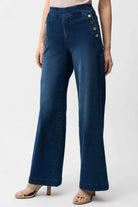 Blue jeans worn by a person on a white background