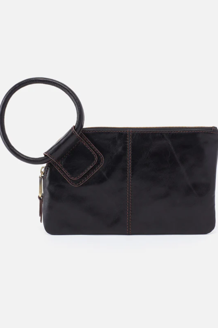 Black clutch bag with a round handle on a white background