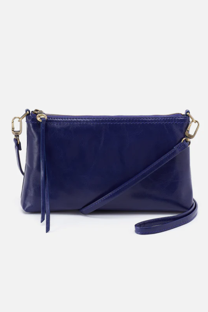 Navy blue handbag with a strap on a white background