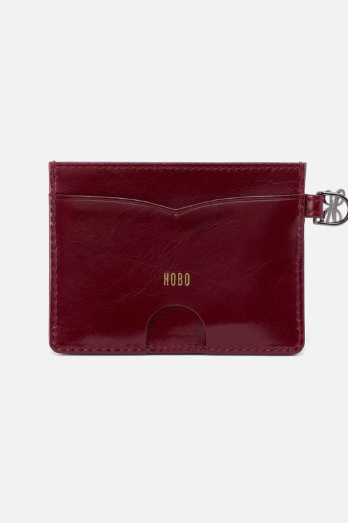 Red cardholder with 'Hobo' branding on a white background