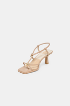 Beige high-heeled sandal on a light gray background
