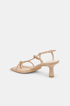 Beige sandal with a small heel on a white background