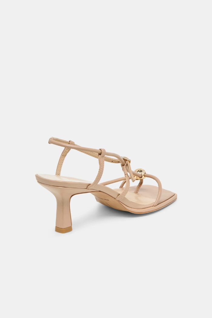 Beige sandal with a high heel on a white background