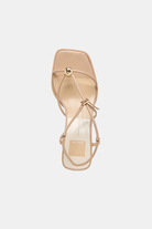 Beige sandal with clear sole on a white background