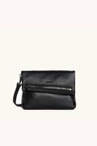 Black leather handbag with a zipper on a white background