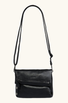 Black leather crossbody bag on a white background