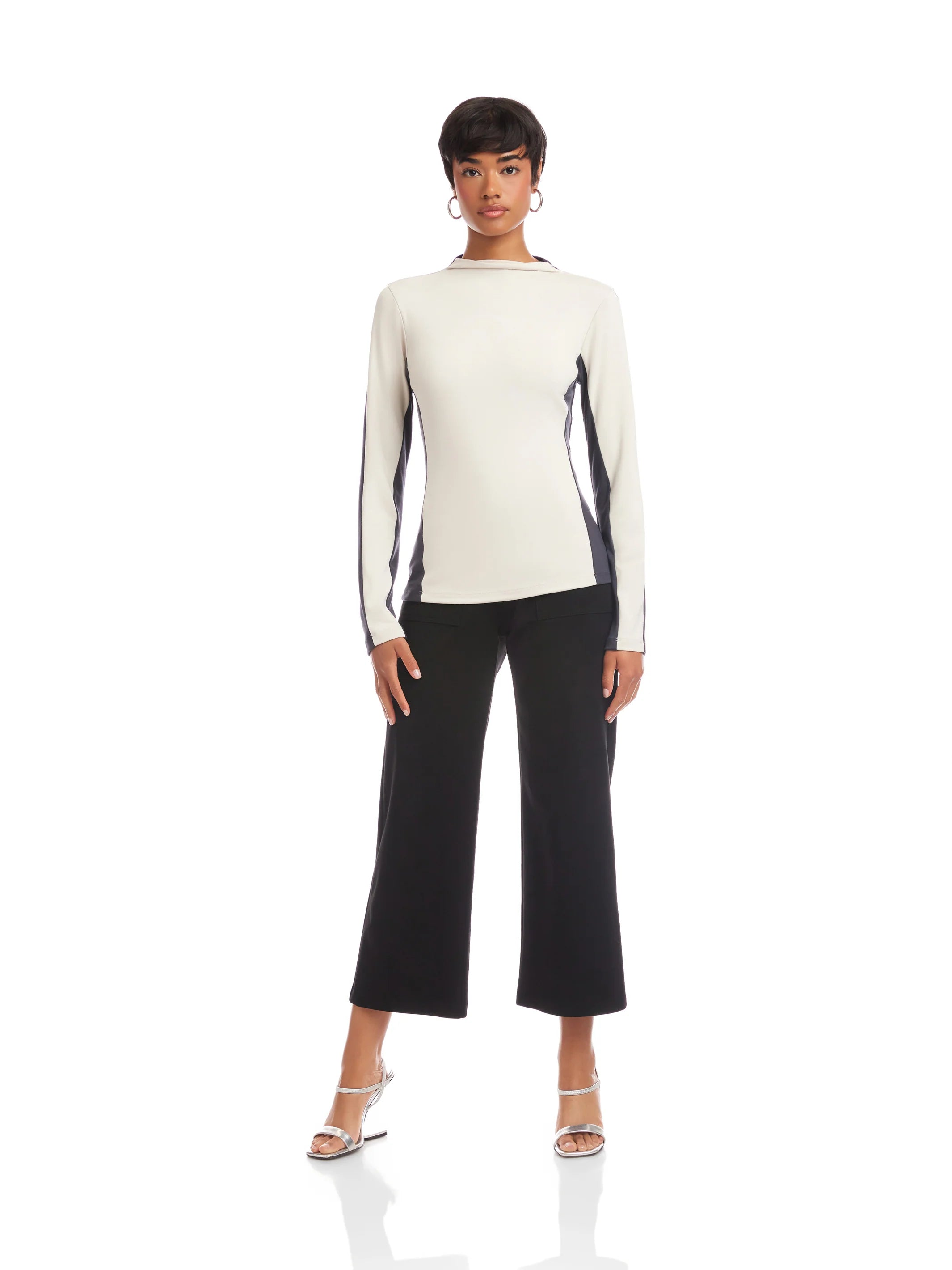Woman wearing a white and black outfit on a white background
