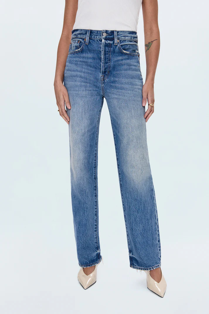 Person wearing blue jeans on a white background