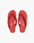 Red sandals with ruched straps on a white background