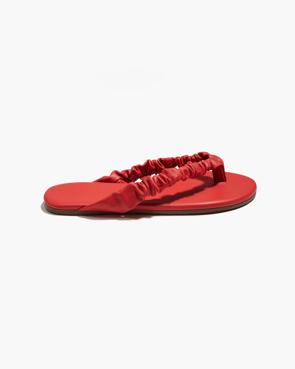 Red sandal with a strap on a white background