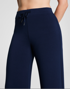 Navy blue pants with a drawstring on a light gray background