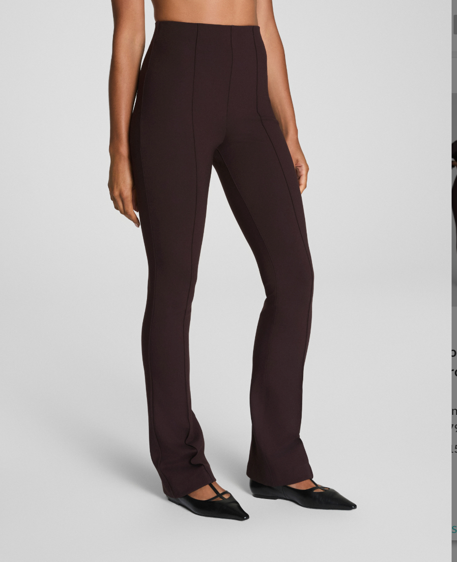 Brown pants worn by a person on a plain background