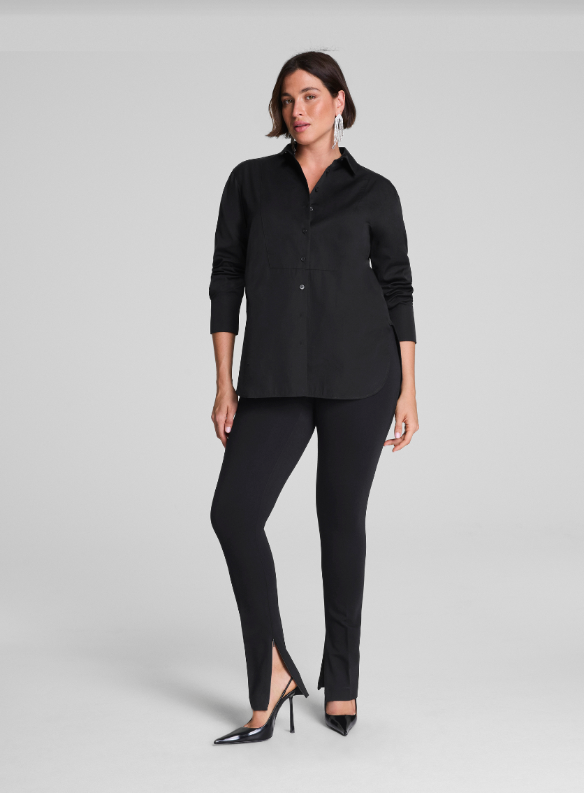 Woman wearing a black outfit on a gray background