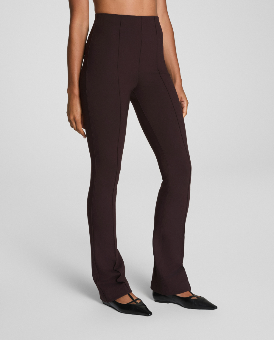Brown pants worn by a person on a light gray background