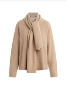 Beige sweater with matching scarf on a white background