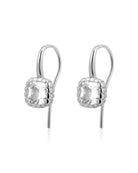 Silver earrings with clear gemstones on a white background