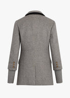 Gray coat with ribbed cuffs on a white background