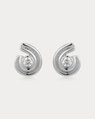 Pair of silver earrings with diamond-like centers on a white background